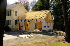 a house under construction in the woods