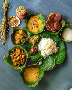 several different types of food in leaf bowls