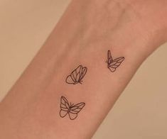 three butterflies tattoo on the wrist