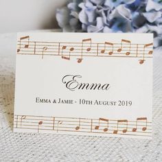 a place card with musical notes on it