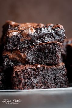 chocolate brownies stacked on top of each other