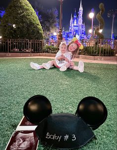 Pregnancy announcement with baby number 3 at Disney world. Sisters hugging in the background Disney Announcement To Kids, Pregnancy Announcement Baby # 4, Announcing Baby #3, Disney Baby Announcement With Sibling, Disney Pregnancy Announcement 2nd, Disney World Baby Announcement, Disneyland Baby Announcement, Pregnancy Announcement 4th Baby