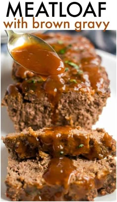 meatloaf with gravy being spooned over it on a white plate