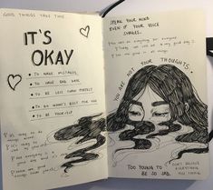 an open notebook with handwritten notes and drawings on the pages that say it's okay