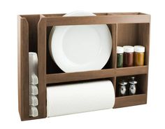 a wooden shelf with some plates and other items in it