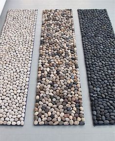 three different types of pebbles on the ground