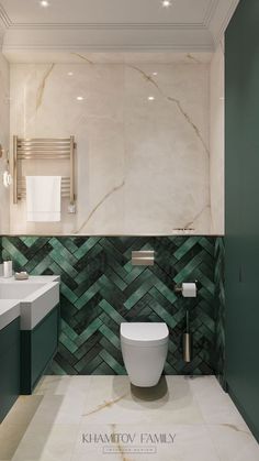 a bathroom with green and white tiles on the walls