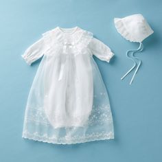 A gorgeous, pure white ceremony dress for those special moments meant to be cherished for a lifetime. Celebrate each and every of life's special occasions. Perfect for baby's first day out of the hospital, a birthday, a family portrait, or any moment to be adored. This 3-piece set contains an organdy coat delicately embellished with a beautiful emrboidery, two-way playsuit, and baby bonnet. Complete the look with our ceremony bib, shoes, socks, or afghan. - Genderless design - Inside two-way pla Formal White Tulle Gown, White Tulle Gown For Formal Occasion, White Organza Baptism Dress With Ruffles, Elegant Organza Gown For Baptism, Organza Baptism Gown With Ruffles, White Tulle Gown For First Communion, Formal White Gown With Ruffles, White Organza Baptism Gown, Classic White Baptism Dress For Ceremonies