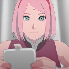 an anime character with pink hair and green eyes looking at a tablet pc computer screen