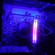 the inside of a computer with purple light