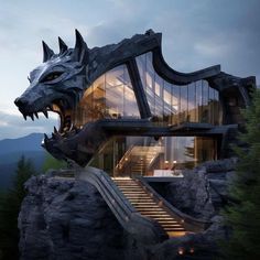 an unusual house with a dragon head on the outside and stairs leading up to it