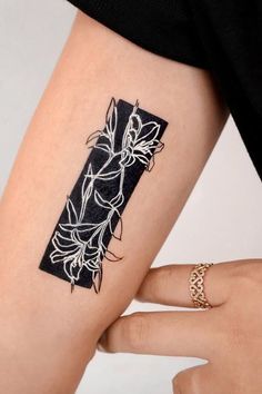 a woman's arm with a tattoo on it