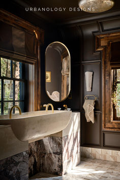 a bathroom with a sink, mirror and marble counter top in front of two windows