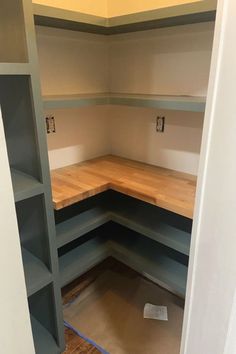 empty shelves in the corner of a room