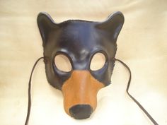 a mask with a dog's face and nose is shown on a white surface