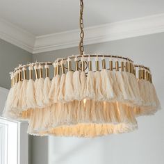 a chandelier hanging from a ceiling in a room