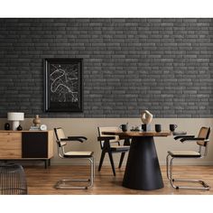 a dining room with black brick walls and chairs