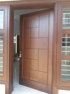 an open wooden door on the outside of a house