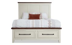 a bed with two drawers underneath it and a white headboard on top of it