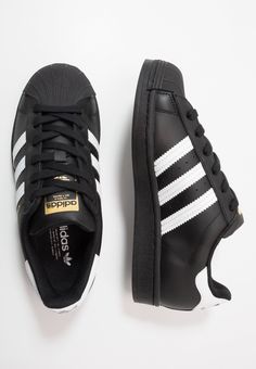 adidas Originals SUPERSTAR UNISEX - Trainers - core black/footwear wihte Black Adidas Trainers, Adidas Superstar Black, Black Superstar, Homecoming Shoes, Black Footwear, Superstars Shoes, Adidas Spezial, Adidas Originals Superstar, Hype Shoes