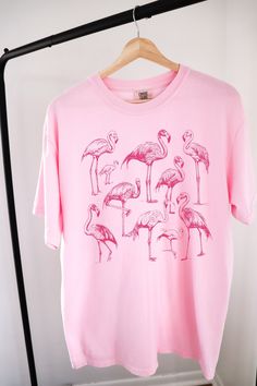 Vintage Flamingo Shirt ⭐ Welcome to K & K Custom Tees! ⭐  - Indulge in pure comfort with our Comfort Colors Shirt. Soft, relaxed, and available in a variety of colors! ⭐SHIRT DETAILS⭐  -High Quality fabric  -100% ring-spun US cotton -Designed and printed in the USA  ⭐ PLEASE NOTE ⭐ -For an oversized look, we suggest to size up 1-2 sizes. These shirts run like standard unisex tees. Please see size chart for a more fitted look!  -Colors may vary based on your monitor or screen display! ⭐CARE INSTRUCTIONS ⭐ -Machine wash inside out in cold water  -Tumble dry medium or hang to dry  -Do not dry clean or iron directly onto the design  ⭐PROCESSING & SHIPPING TIMES ⭐ -Processing time: 3 to 5 business days  -Shipping time: US - 2 to 5 business days  ⭐OUR GOAL⭐  -Delivering top-notch t-shirts that e Pink Funny Print Graphic Tee Shirt, Pink Funny Print Graphic Tee, Pink Graphic Tee With Funny Print, Summer Cotton Tops With Flamingo Print, Summer Cotton Top With Flamingo Print, Casual Crew Neck T-shirt With Flamingo Print, Cotton Top With Flamingo Print For Summer, Casual Cotton Tops With Flamingo Print, Casual Cotton T-shirt With Flamingo Print