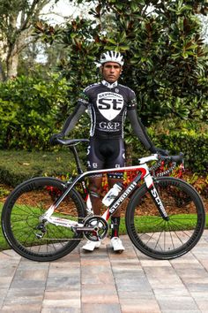 a man is standing next to his bike