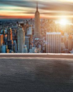 a skateboarder is doing a trick in front of a cityscape