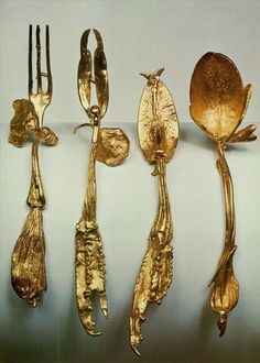 four different types of gold colored utensils