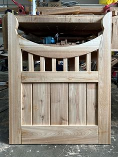 an unfinished wooden gate in the process of being built