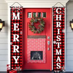 a red front door decorated with christmas decorations