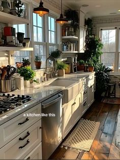 a kitchen filled with lots of white cabinets and counter tops next to a stove top oven