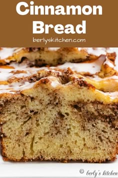 cinnamon bread with icing on top is cut in half and sitting on a white plate