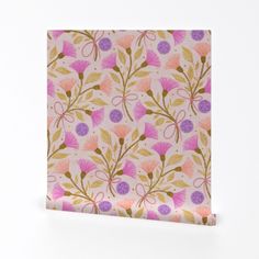 a pink and purple flowered paper with gold foil on the bottom, in front of a white background