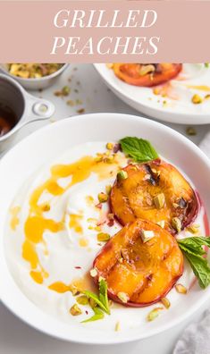 grilled peaches with yogurt and pistachio sauce on a white plate