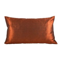 an orange pillow with a satin finish on the front and back, sitting against a white background