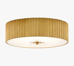 a ceiling light with a gold pleated shade