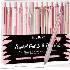 the pink and white pen is next to each other in front of an assortment of pens