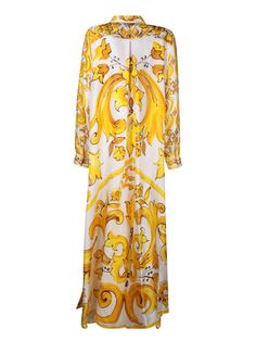 Long dress in light and breathable fabric with Maiolica print. Features frontal button closure and a classic collar.. This Dolce & Gabbana long dress captivates with its lively yellow and gold Maiolica print, offering an elegant cut that gently cascades down the body. Perfect for spectacular occasions or a sophisticated evening outGender: WomenMaterial: 100% SILKColor: YELLOWMade in: ImportedProduct ID: F6JDET HI1TK HG3TN*Import tax/duty will be calculated at checkout (If applicable) Luxury Baroque Print Dress, Designer Printed Summer Dresses, Luxury Yellow Silk Dresses, Elegant Yellow Printed Dress, Elegant Silk Dress With Baroque Print, Gold Floral Print Maxi Dress, Printed Silk Daywear Dresses, Yellow Silk Maxi Dress Floor-length, Yellow Silk Floor-length Maxi Dress