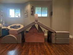 a living room filled with furniture and wooden floors