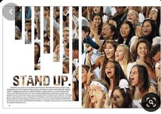 an image of a group of people with their hands in the air and standing up