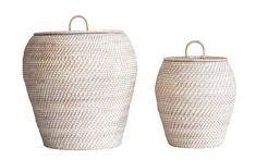 two white baskets sitting next to each other on top of a white surface with handles