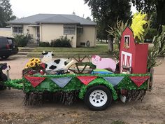 a truck with decorations on the bed in front of a house