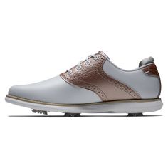 a women's golf shoe in white and pink leather with metallic accents on the upper part