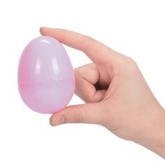 a hand holding an egg shaped object in it's left hand on a white background