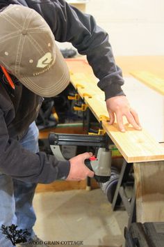 a man working on a piece of wood