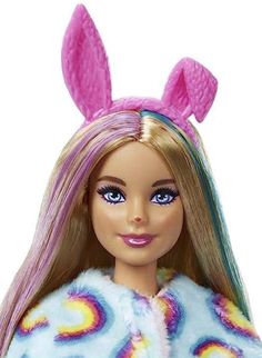 a barbie doll with long blonde hair and blue eyes wearing a pink bunny ears outfit