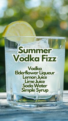 a close up of a glass of water with a lemon slice on the rim and an advertisement for vodka fizz