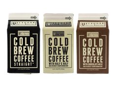 three boxes of cold brew coffee sitting next to each other on a white background,