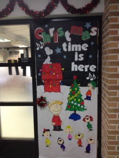 a door decorated with christmas time is here decorations