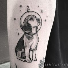 a black and white drawing of a dog wearing a space helmet on its head with stars in the background